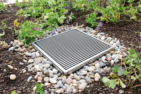 Drainage gullies help dewater the raised beds, among other things, which are exposed to high volumes of precipitation due to their exposed location.
