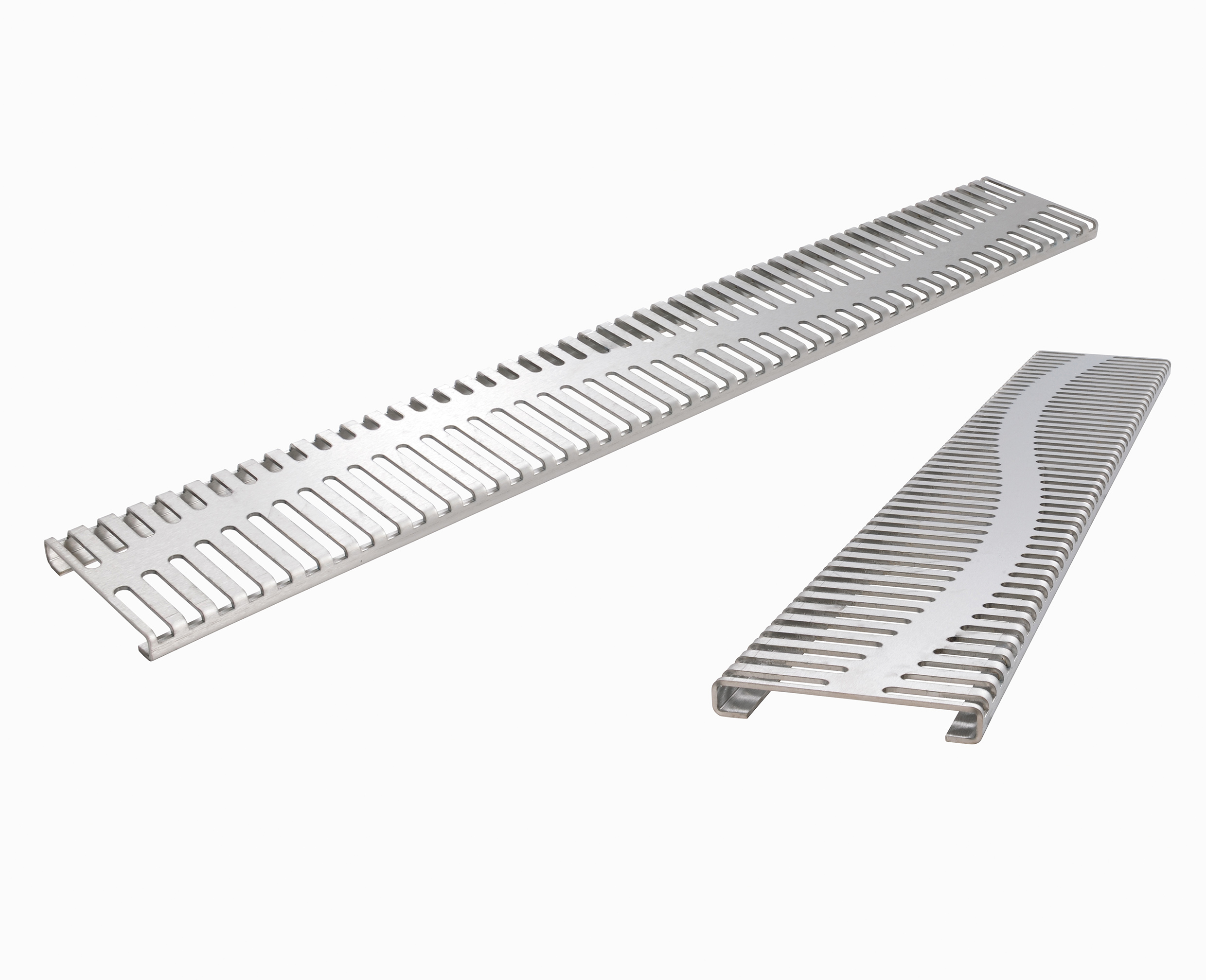 Strikingly unique: the stainless steel Rivo designer grating features slot-like perforations visually broken up by a wavy line running through them.