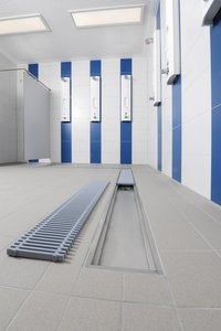Plastic swimming-bath gratings were used as covers. Their dimensions were taken into account when manufacturing the bespoke channels.