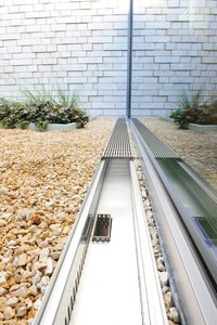 Several Subterra branch channel systems were installed to direct water from the façade channels to various drains within the atriums.