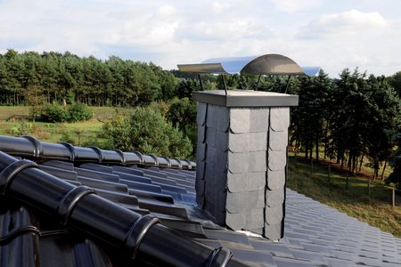 It took around eight hours for the roofers to complete the entire chimney, including the seal, roof slates and installation of the cap.