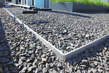 The substrate rails can further be used to create divisions between different roof spaces featuring gravel beds.