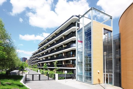 The building complex comprises four six-storey blocks that sit between two barrel-shaped structures which used to form part of the Gleisdreieck multi-storey car park.